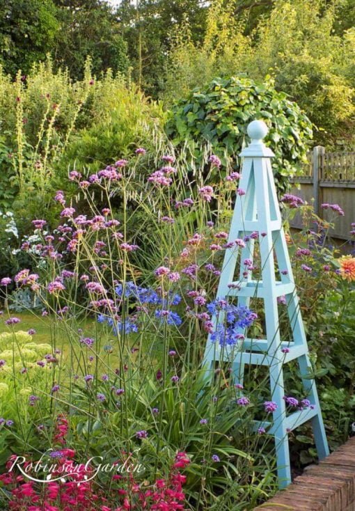 Bespoke wooden garden obelisk design hand painted in Lincolnshire, England, UK using Farrow & Ball exterior eggshell paint. Uniquely crafted using sustainable FSC certified timber / wood. Available in a range of sizes including 5ft (5 foot), 6ft (6 foot) and 7ft (7 foot) as well as trellised design, 8ft design available on request. We sell small garden obelisk, large garden obelisk and tall garden obelisk, The wooden obelisk design is different to Argos, B&M, ALDI, homebase, dobbies, gardman, home bargains, pets at home, B&Q, b & q, amazon, M&S, Robert dyas, rspb, ikea, john lewis, rhs, gumtree, asda, argos, wilkinsons, kingfisher, the garden obelisk company, QVC or any other garden centre. We are an online only store and we are not on the high street. We also have outlet shops across etsy and ebay UK. Not made from metal or copper. Our design plan, dimensions and height are suitable for climbing plants including Roses, sweet peas and is freestanding and a perfect gift for garden lovers. Wooden garden obelisk assembly free and no set up required. Visit out gallery to see all the wooden obelisk images. Wooden obelisk / garden obelisk delivered ready assembled. Perfect bird table for your garden, choice of ball, acorn and unique finial. Designs include Windsor wooden obelisk and Buckingham wooden obelisk. A smart English garden eiffel obelisk. Can be purchased as a set of 3 for your garden.